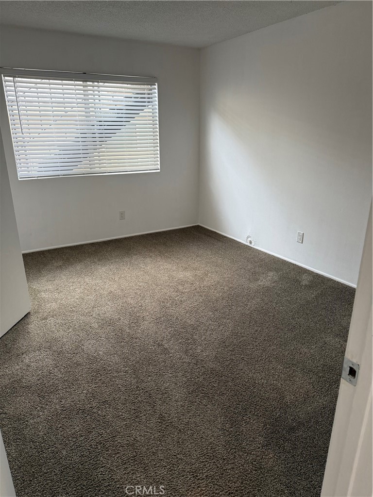 308 Avenida Granada, Unit A San Clemente, CA 92672 - Photo 3 of 9 an empty room with a window