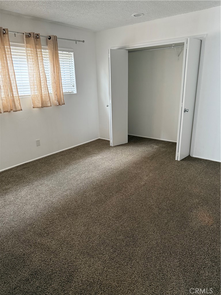 308 Avenida Granada, Unit A San Clemente, CA 92672 - Photo 4 of 9 an empty room with windows