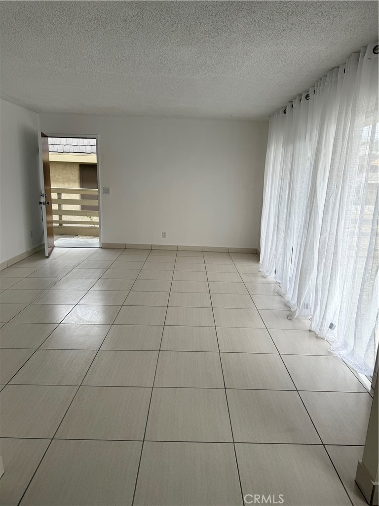 308 Avenida Granada, Unit A San Clemente, CA 92672 - Photo 5 of 9 a view of an empty room with a window