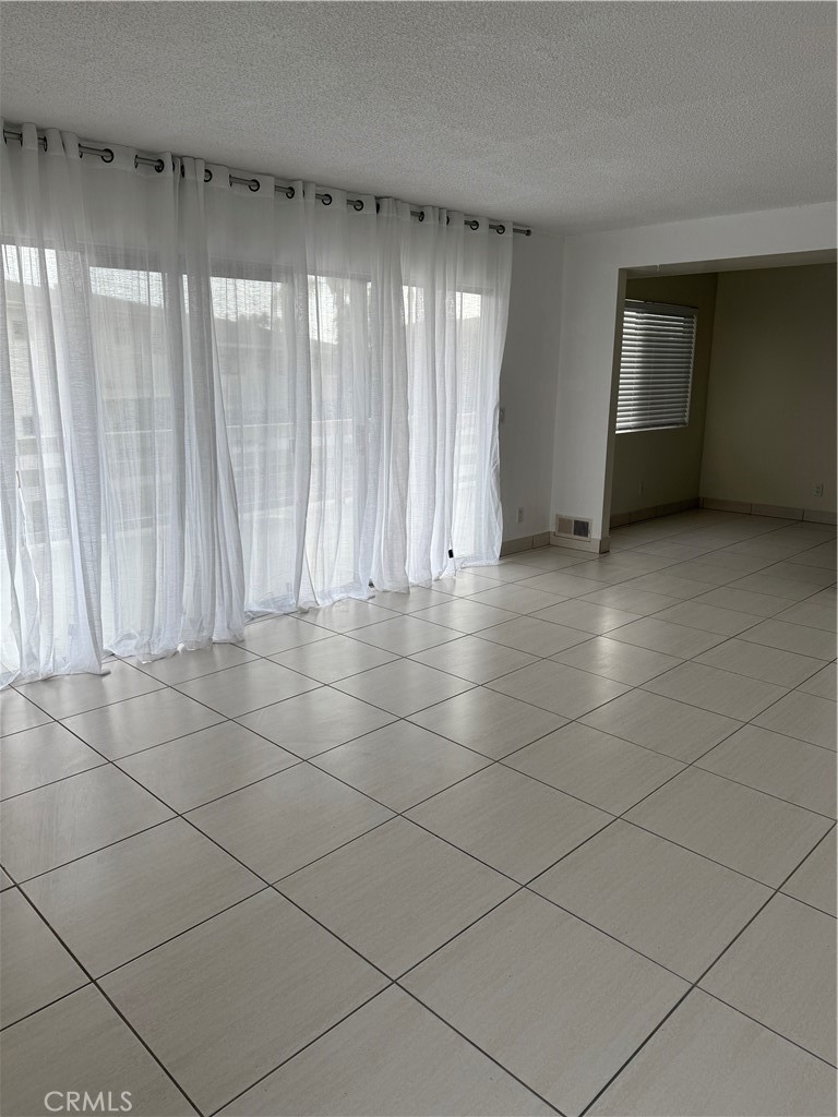 308 Avenida Granada, Unit A San Clemente, CA 92672 - Photo 7 of 9 a view of an empty room and a window