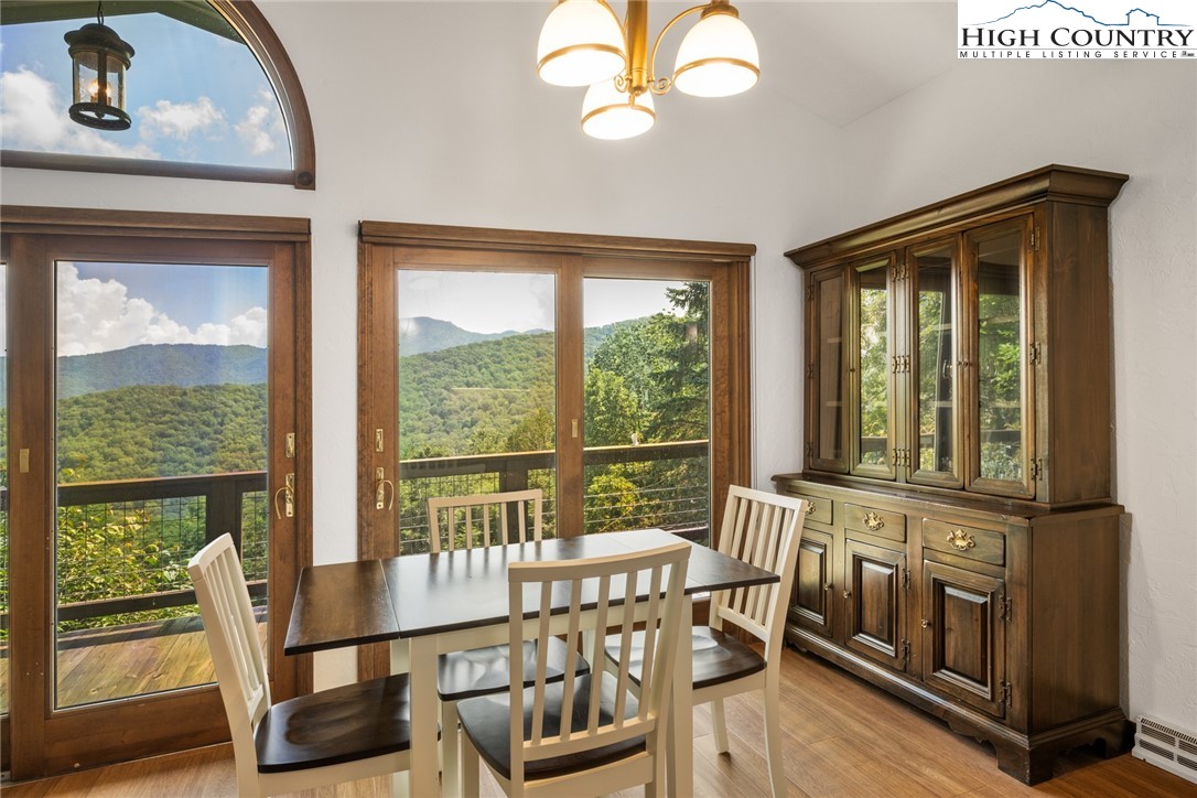 281 Cliffside Lane Seven Devils, NC 28604 - Photo 11 of 29 a view of a city from a dining room with furniture window and outside view