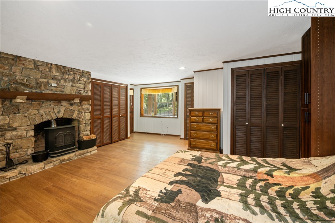 281 Cliffside Lane Seven Devils, NC 28604 - Photo 18 of 29 a bedroom with a bed and a television