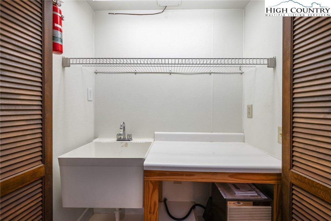 281 Cliffside Lane Seven Devils, NC 28604 - Photo 20 of 29 a bathroom with a sink and a mirror