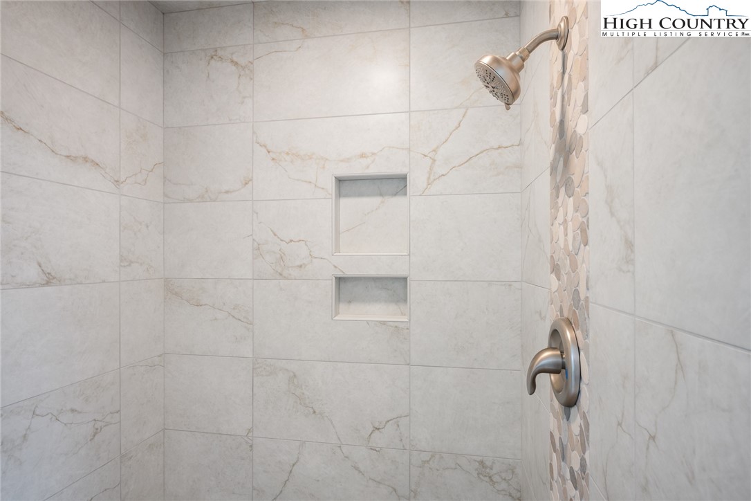 281 Cliffside Lane Seven Devils, NC 28604 - Photo 24 of 29 a bathroom with a shower
