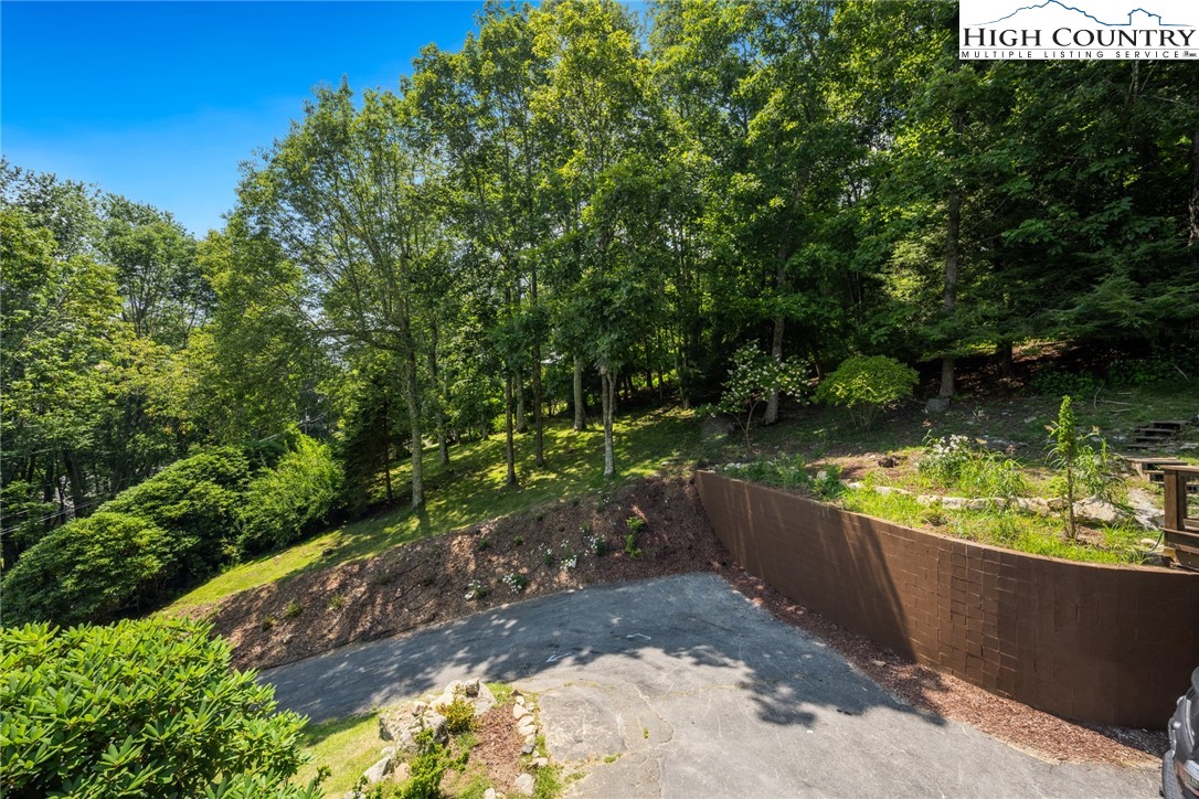 281 Cliffside Lane Seven Devils, NC 28604 - Photo 27 of 29 a view of a garden from a balcony