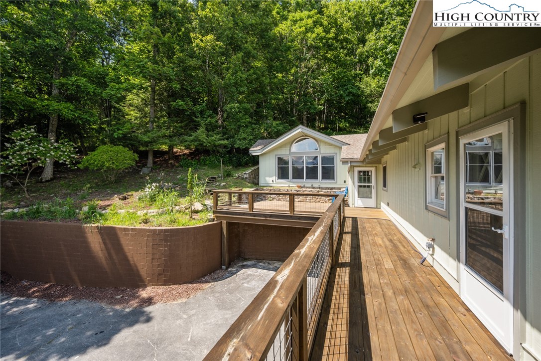 281 Cliffside Lane Seven Devils, NC 28604 - Photo 4 of 29 a view of balcony with wooden floor and fence