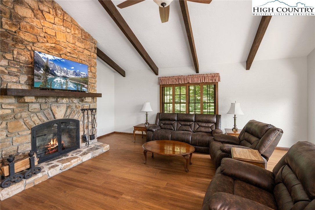 281 Cliffside Lane Seven Devils, NC 28604 - Photo 7 of 29 a living room with furniture and a fireplace