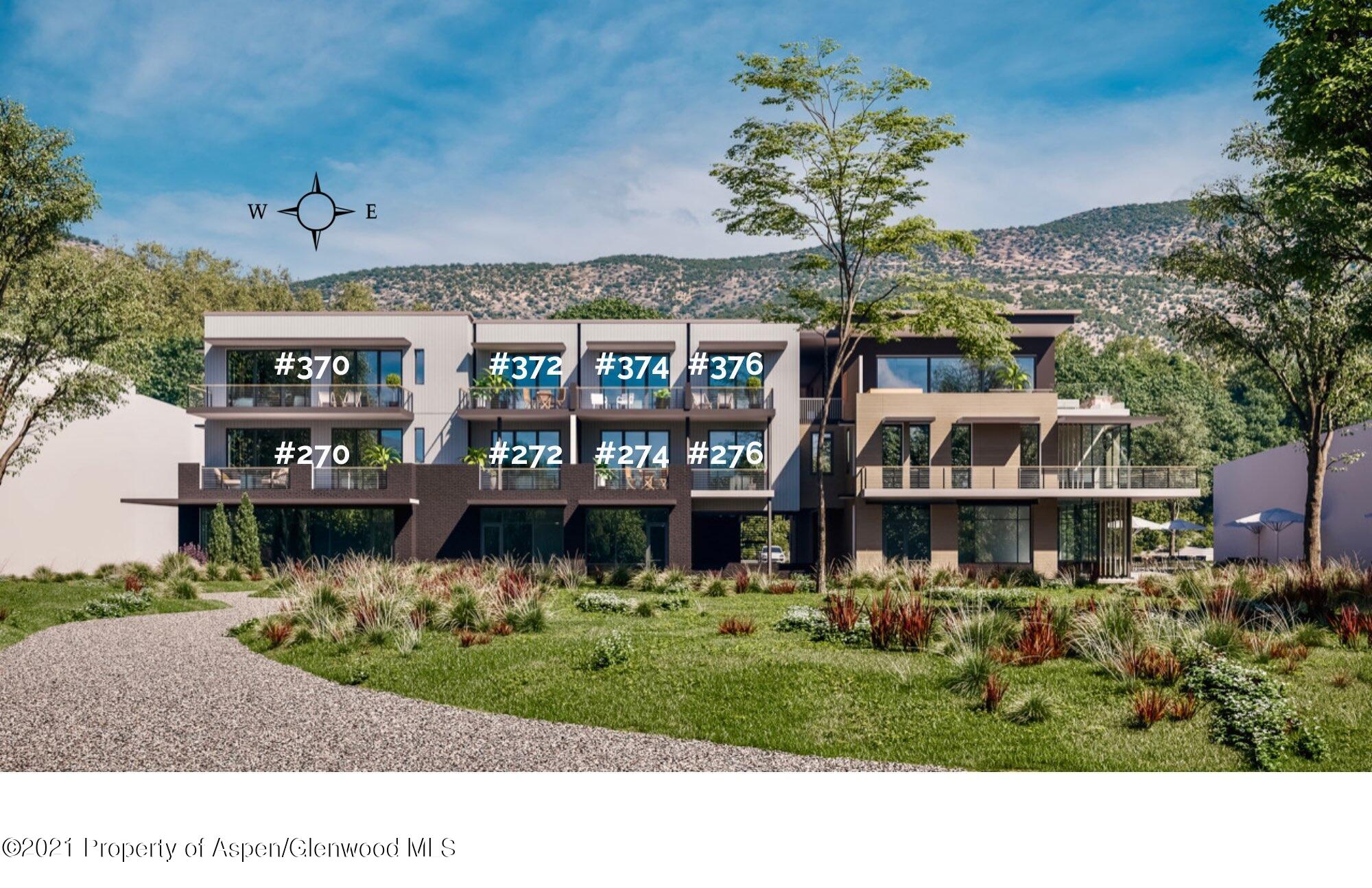 22860 2 Rivers Road, Unit THE RIVER LOFTS 370 Basalt, CO 81621 - Photo 2 of 7 a front view of a house with a yard and fountain