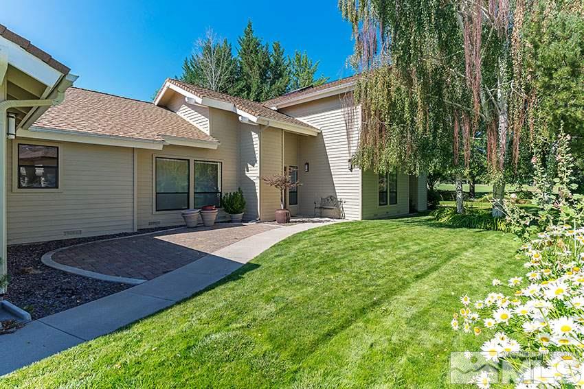 4655 Lakewood Court Reno, NV 89509 - Photo 1 of 21 front view of a house with a yard