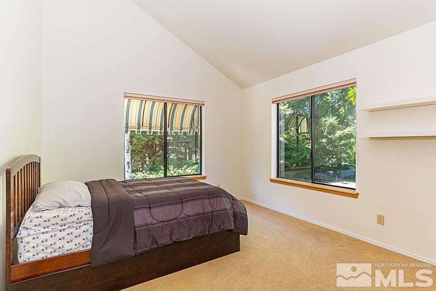 4655 Lakewood Court Reno, NV 89509 - Photo 14 of 21 a bedroom with a bed and a large window