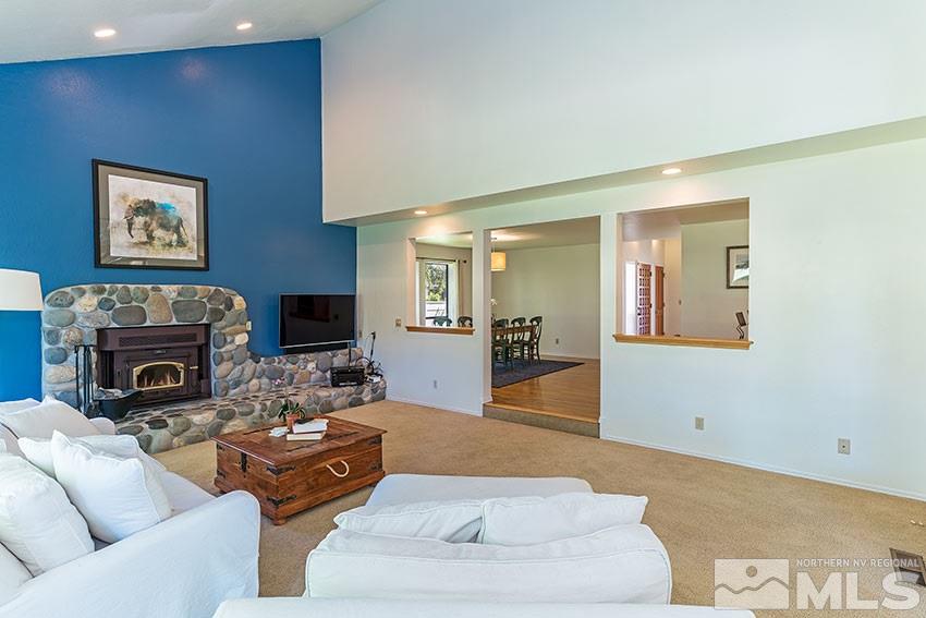 4655 Lakewood Court Reno, NV 89509 - Photo 2 of 21 a living room with furniture and a fireplace