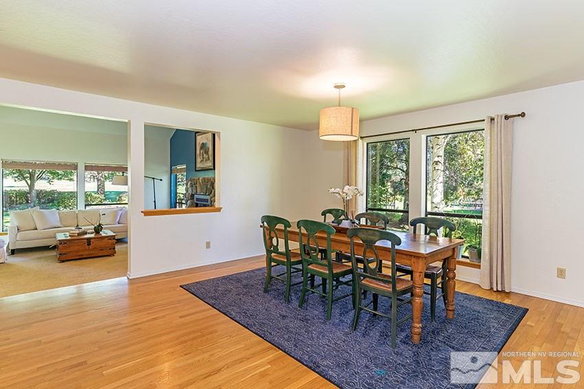 4655 Lakewood Court Reno, NV 89509 - Photo 5 of 21 a view of a dining room with furniture and wooden floor