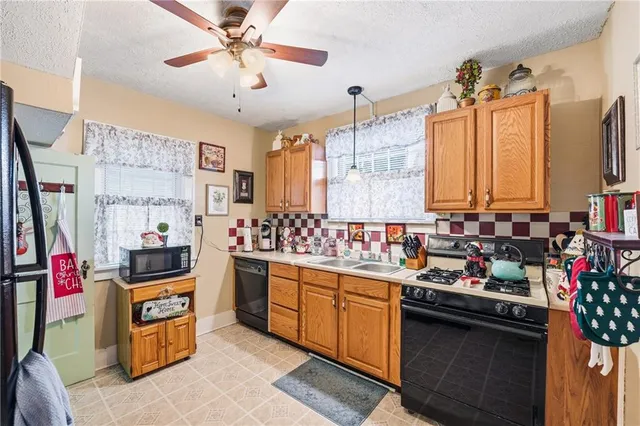 a kitchen with lots of counter top space and appliances