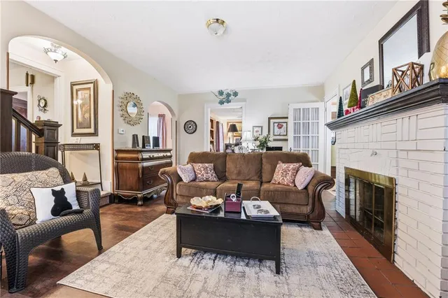 a living room with furniture or couch and a fireplace