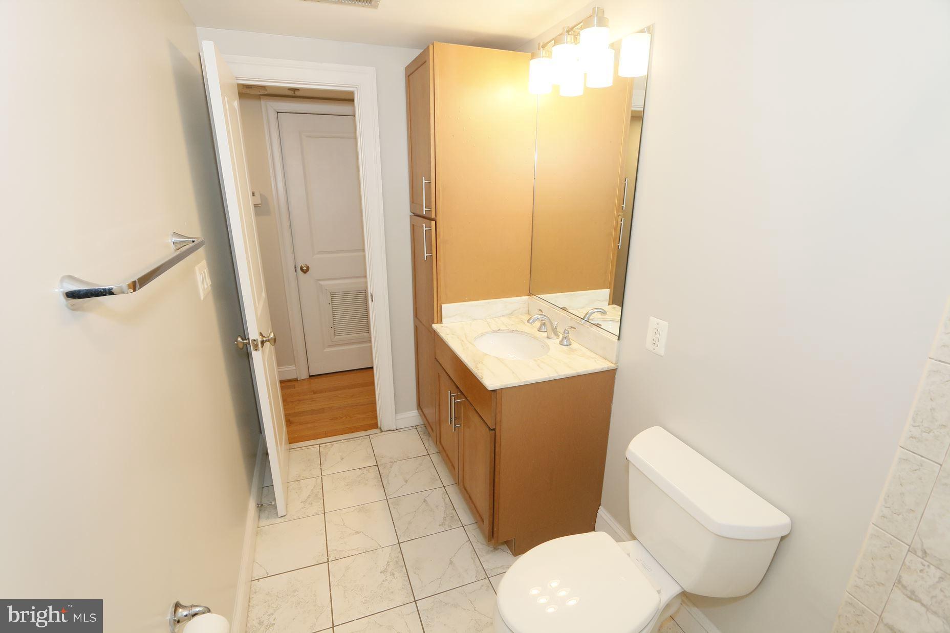 1901 Lincoln Road Northeast, Unit 101 Washington, DC 20002 - Photo 14 of 17 a bathroom with a sink toilet and shower