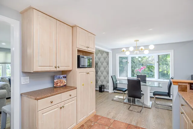 a view of kitchen with furniture and wooden floor