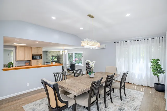 a dining room with furniture and window