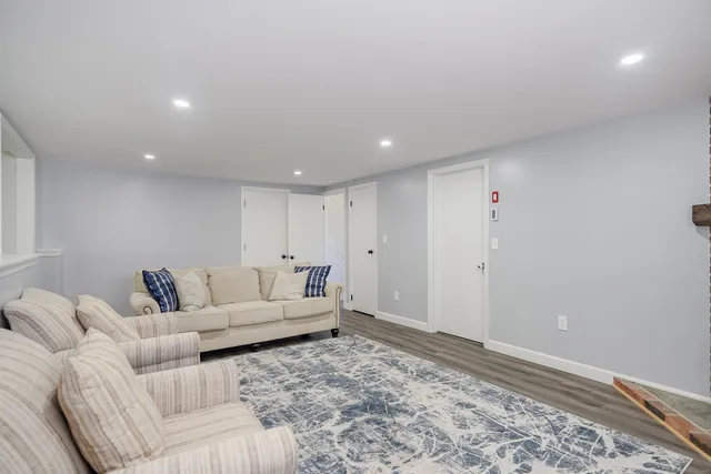 a living room with furniture and a rug