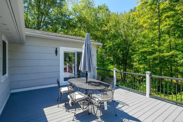 a view of a table and chairs in the balcony