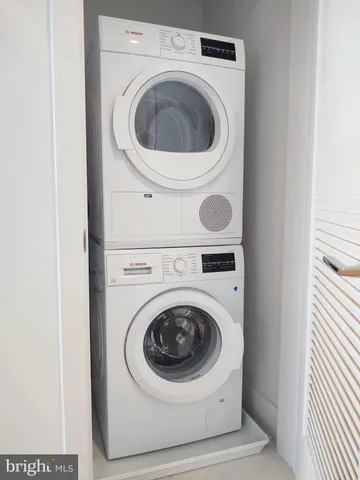 a living room with furniture a rug and a fireplace