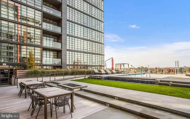 a view of a patio with couches and a table and chairs