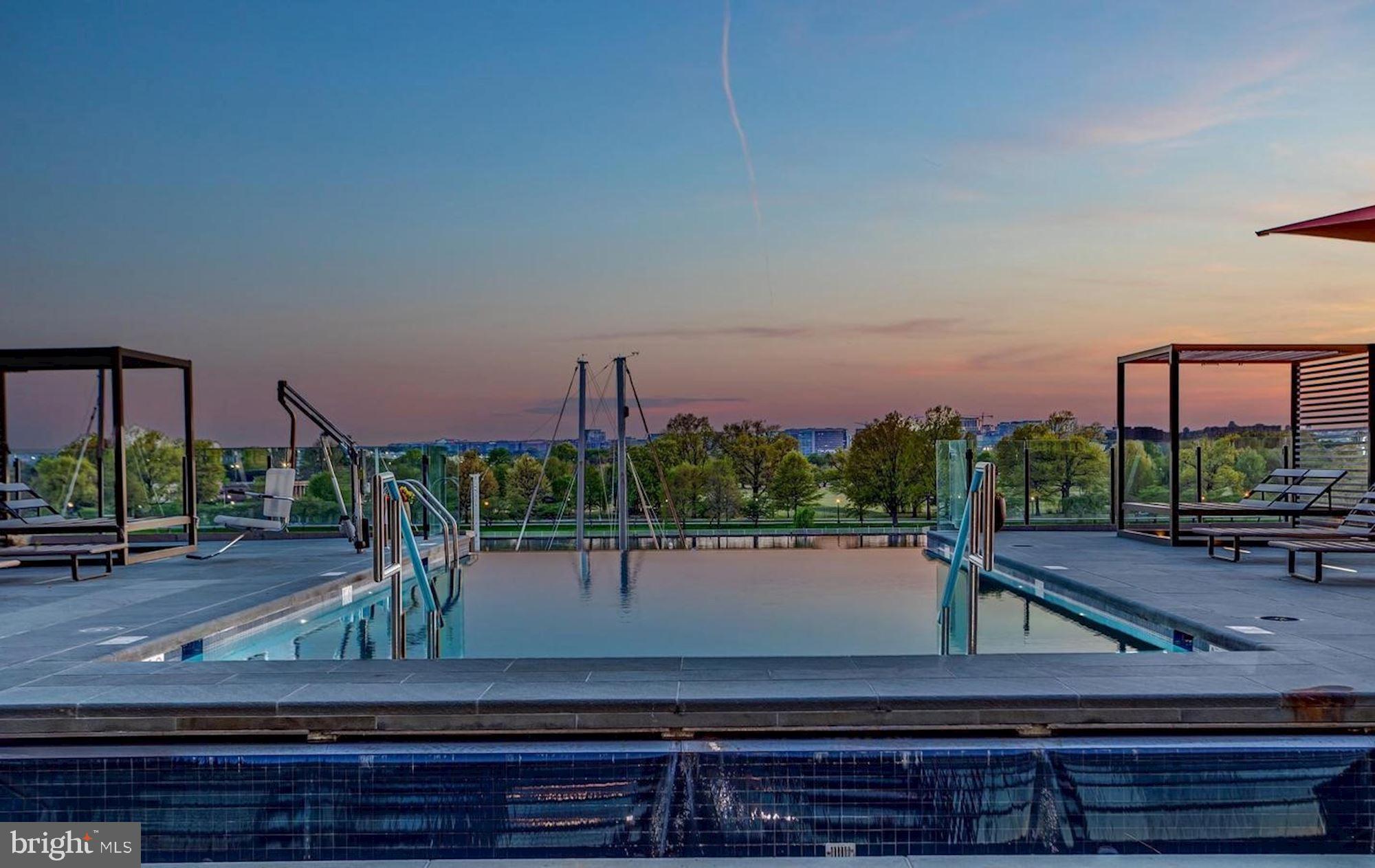 45 Sutton Square Southwest, Unit 1112 Washington, DC 20024 - Photo 32 of 46 Serene rooftop pool at sunset.