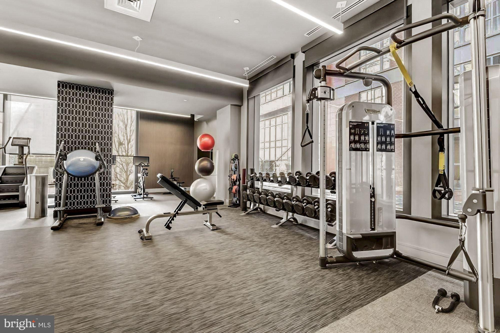 45 Sutton Square Southwest, Unit 1112 Washington, DC 20024 - Photo 36 of 46 Modern fitness space with ample natural light.