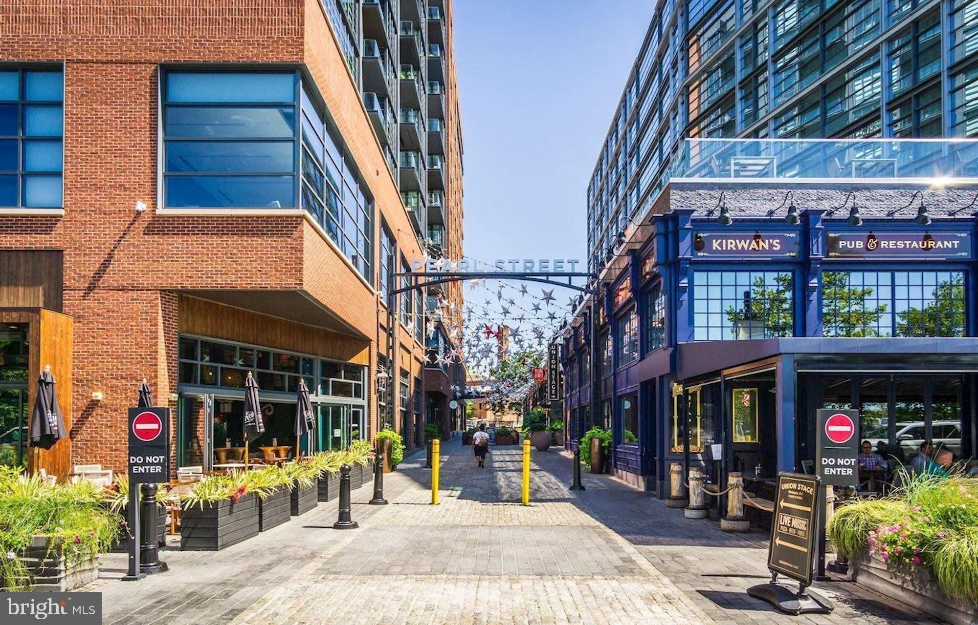 45 Sutton Square Southwest, Unit 1112 Washington, DC 20024 - Photo 41 of 46 The Wharf's cobblestone streets lined with cafes.