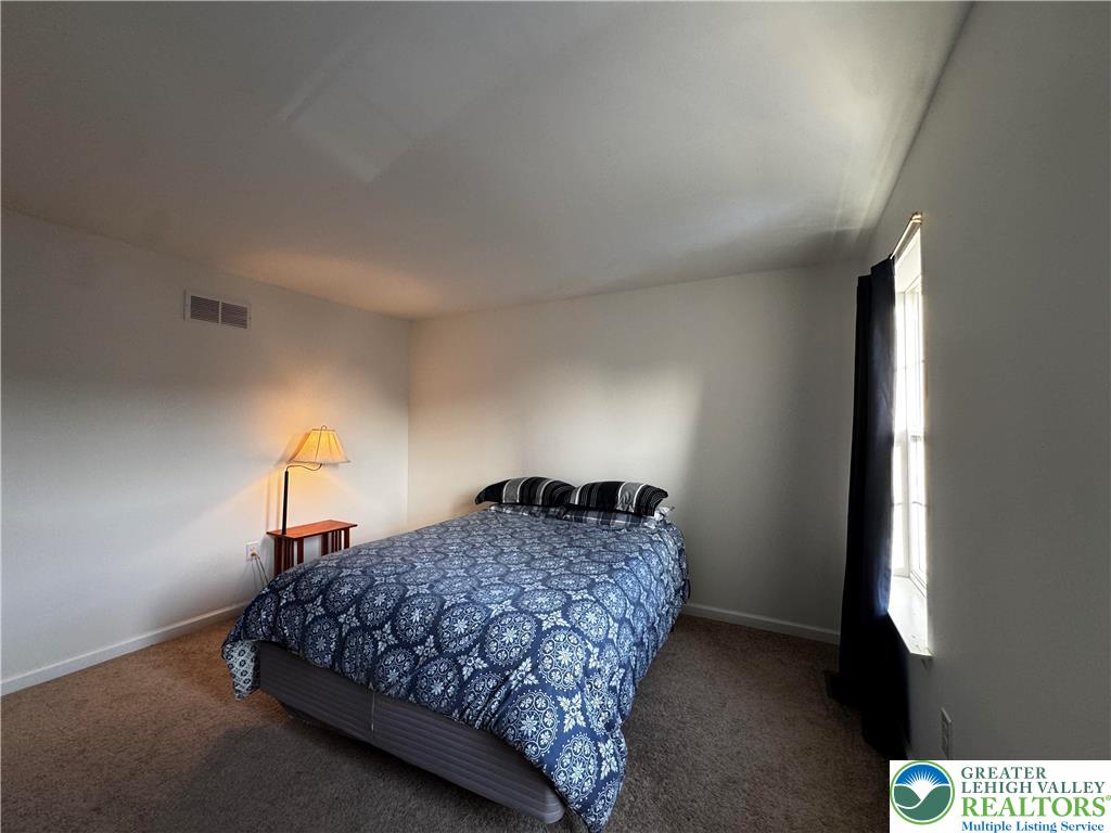 4466 Cottonwood Drive Nazareth, PA 18064 - Photo 14 of 22 a bedroom with a bed and a night stand