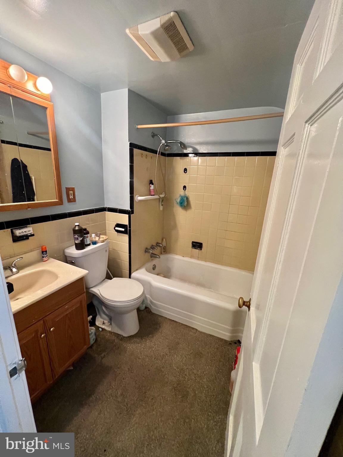 29 Beekman Road Wilmington, DE 19809 - Photo 23 of 32 a bathroom with a sink a toilet a mirror and shower