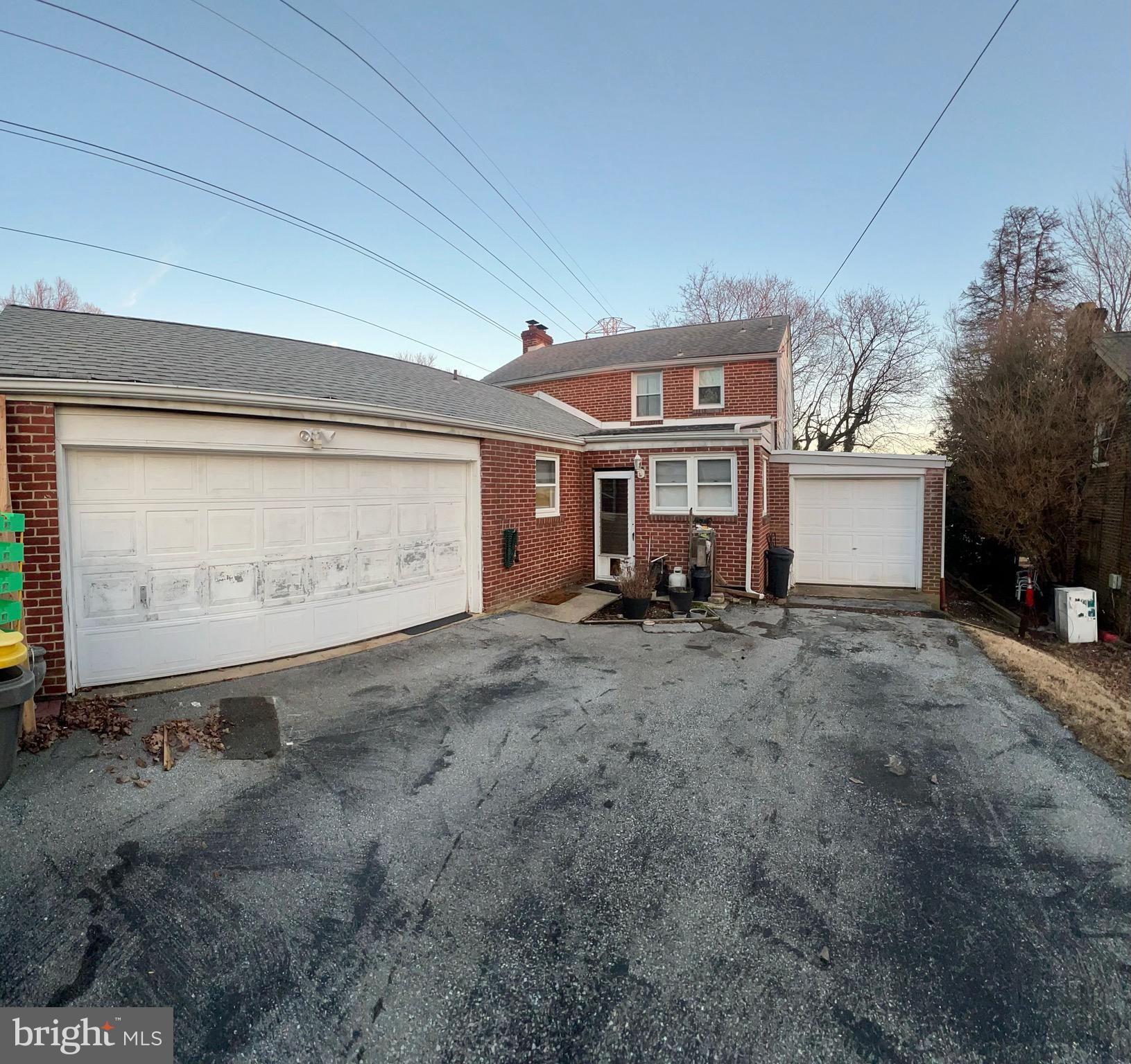 29 Beekman Road Wilmington, DE 19809 - Photo 5 of 32 a front view of a house with a yard and garage