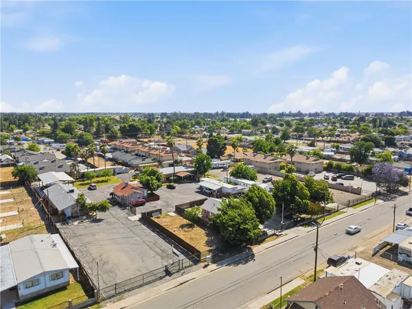 an aerial view of residential houses with city view