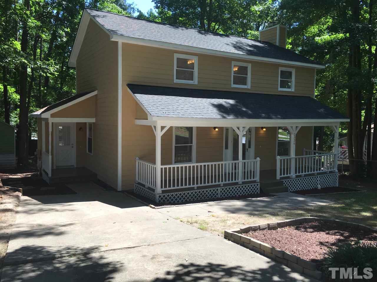 2324 Merganzer Road Raleigh, NC 27616 - Photo 2 of 9 a front view of a house with a yard