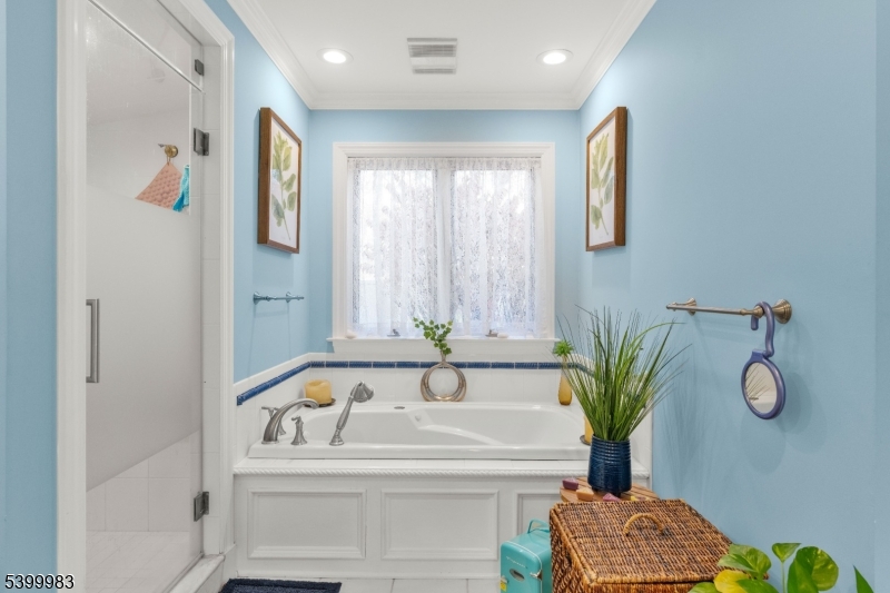 300 Old Farm Road Bedminster, NJ 07921 - Photo 13 of 38 a bathroom with a tub sink and mirror