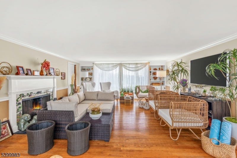 300 Old Farm Road Bedminster, NJ 07921 - Photo 22 of 38 a living room with furniture a fireplace and a flat screen tv
