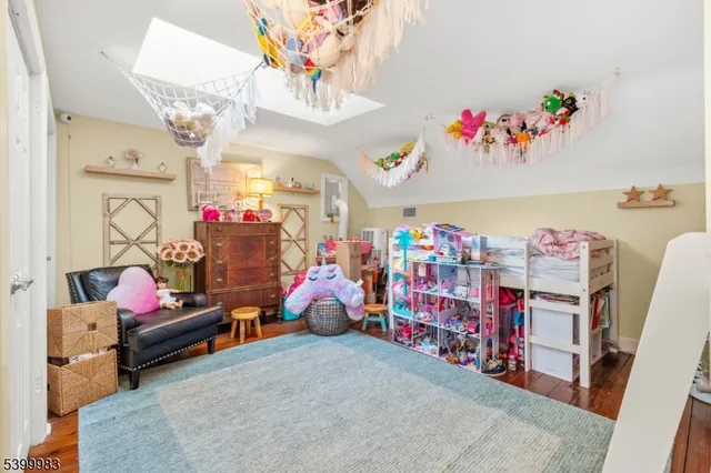 a living room with lots of furniture and toys