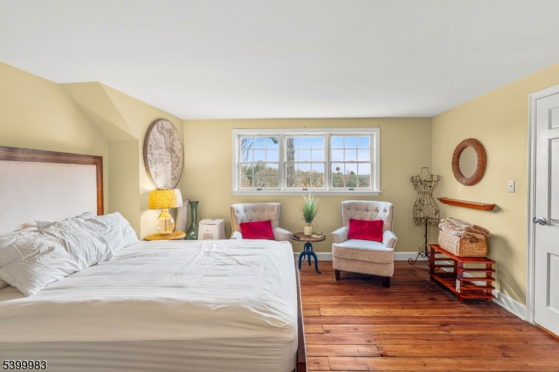 300 Old Farm Road Bedminster, NJ 07921 - Photo 27 of 38 a living room with fireplace furniture and a wooden floor
