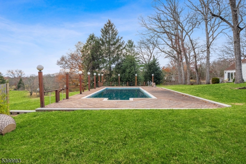 300 Old Farm Road Bedminster, NJ 07921 - Photo 37 of 38 a view of yard with swimming pool and green space