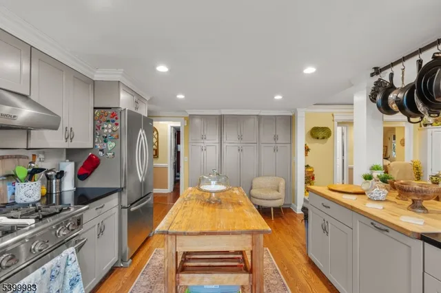 a spacious bathroom with a granite countertop sink and a mirror
