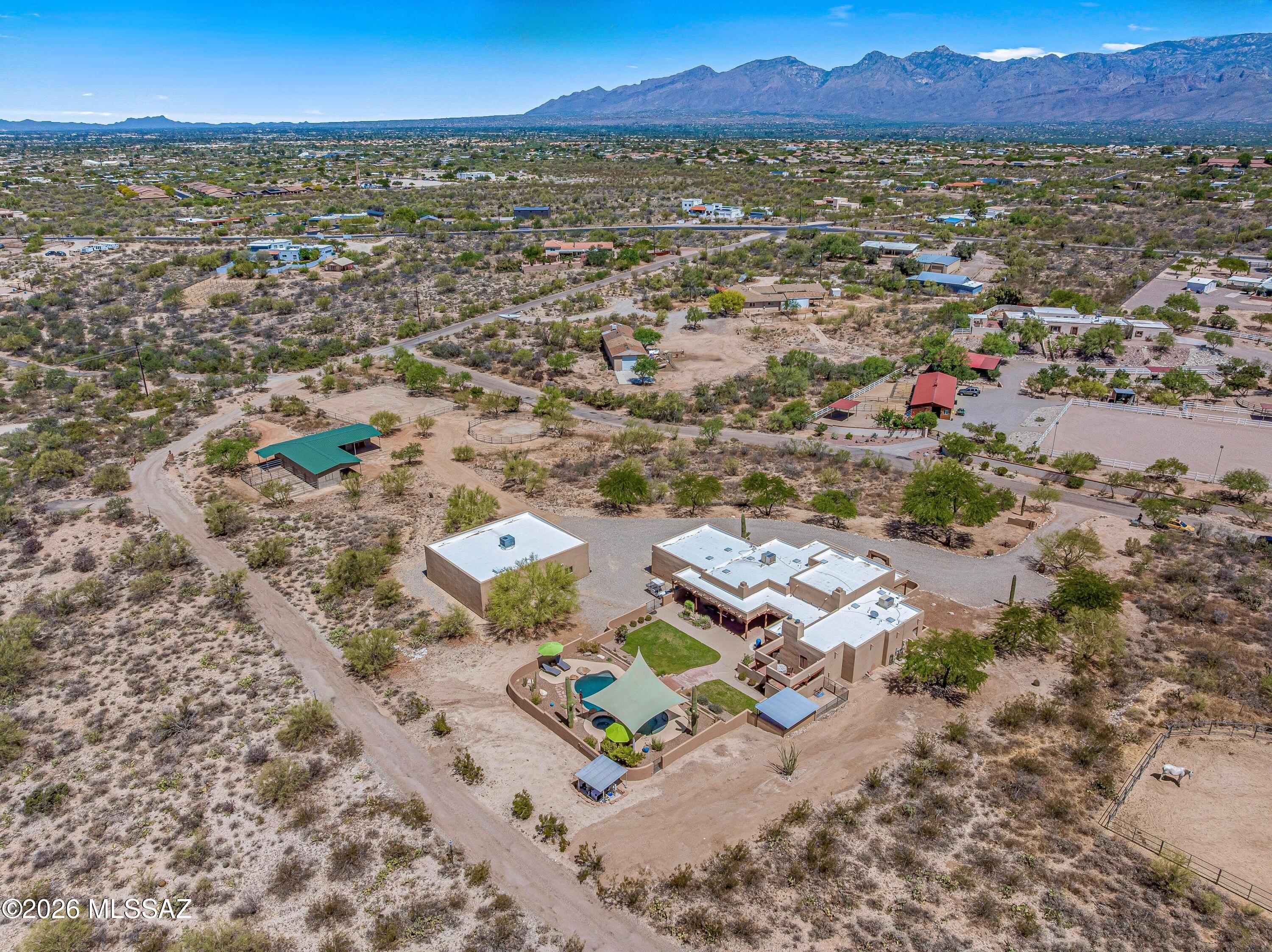 11160 East Golf Links Road Tucson, AZ 85730 - Photo 48 of 51 Aerial on the property facing NW. Horse stalls are under the green roof.
