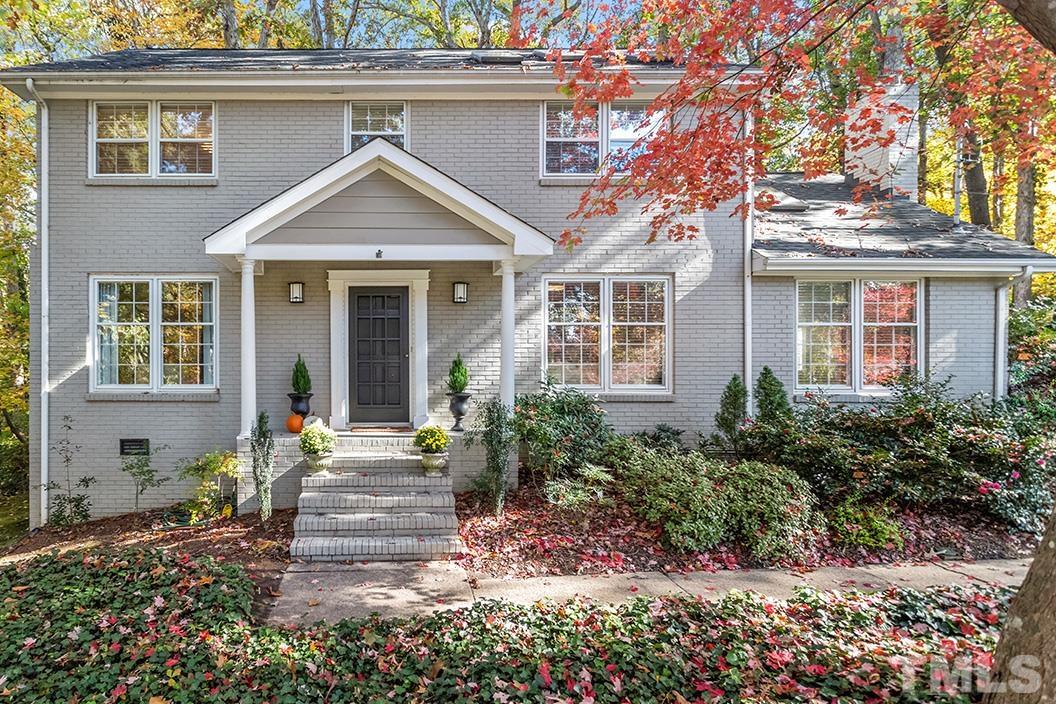2408 Wentworth Street Raleigh, NC 27612 - Photo 1 of 33 a front view of a house with garden