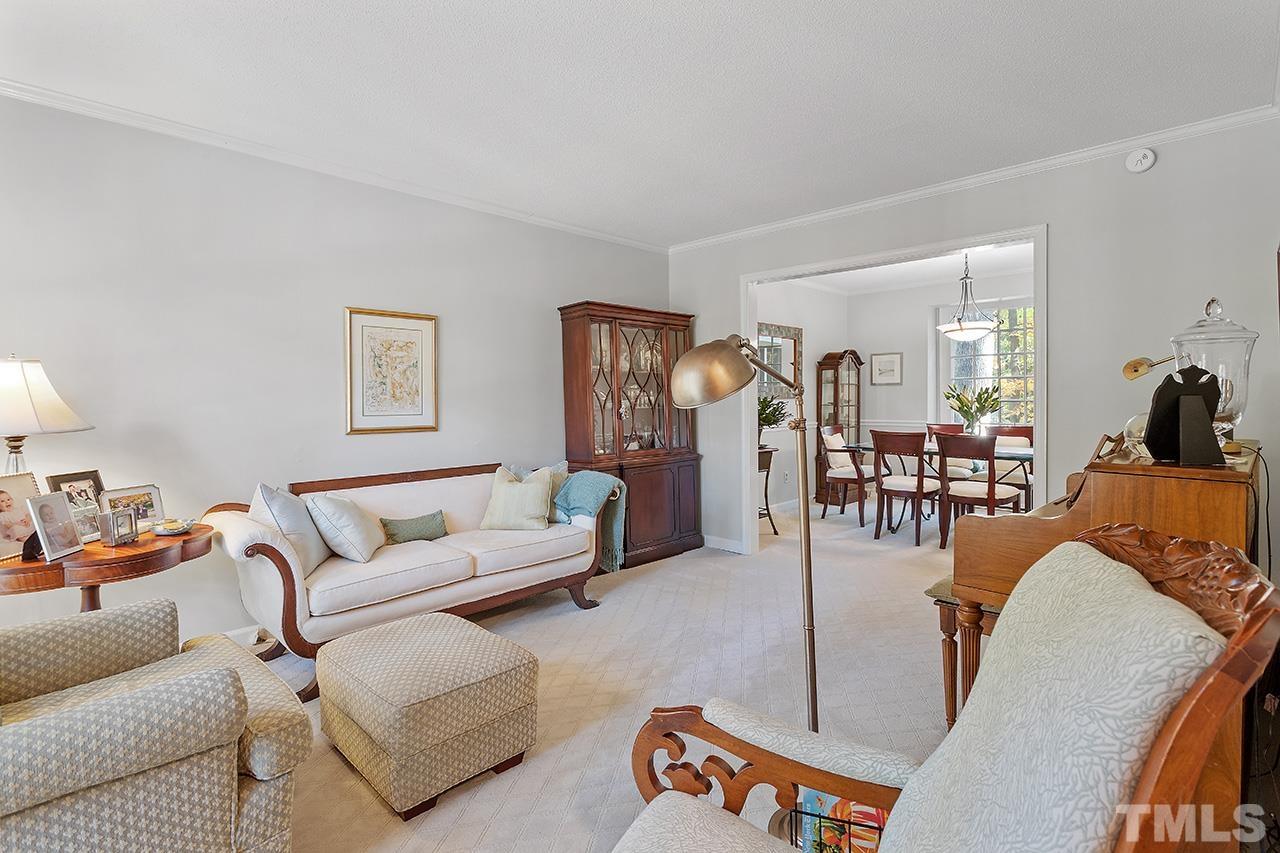 2408 Wentworth Street Raleigh, NC 27612 - Photo 12 of 33 a living room with furniture and a table