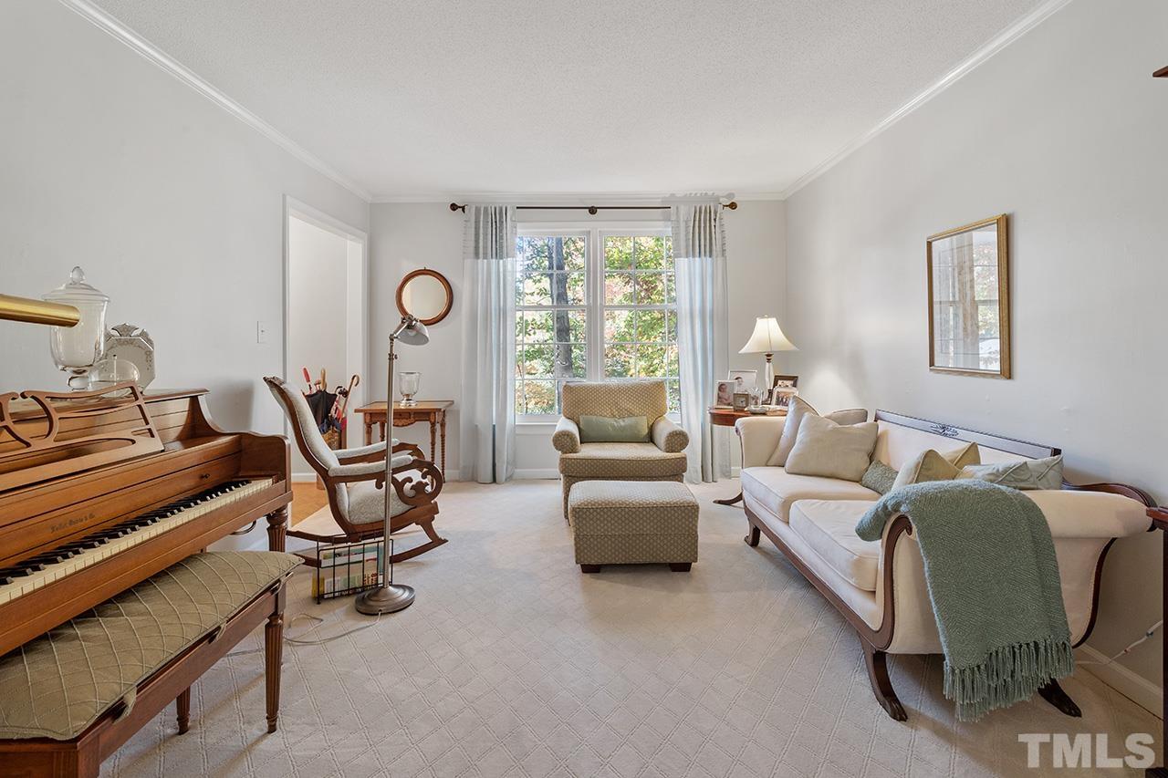 2408 Wentworth Street Raleigh, NC 27612 - Photo 13 of 33 a living room with furniture and a window