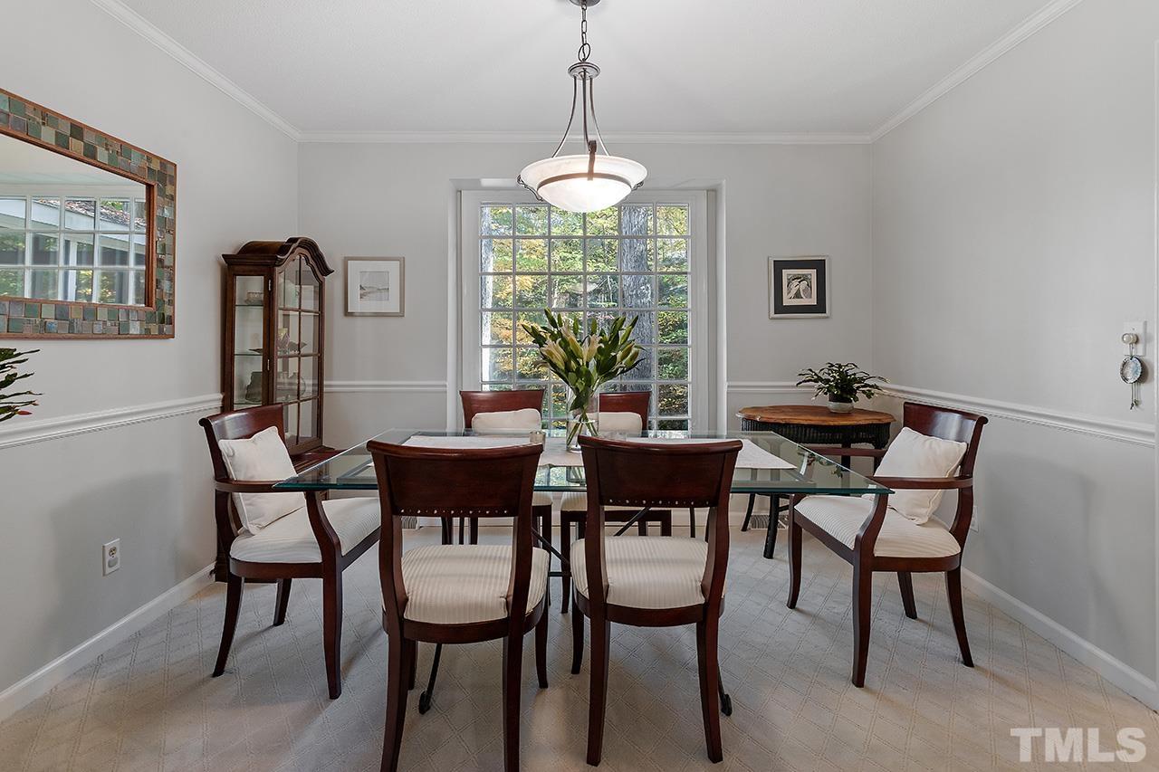 2408 Wentworth Street Raleigh, NC 27612 - Photo 14 of 33 a view of a dining room with furniture window and outside view