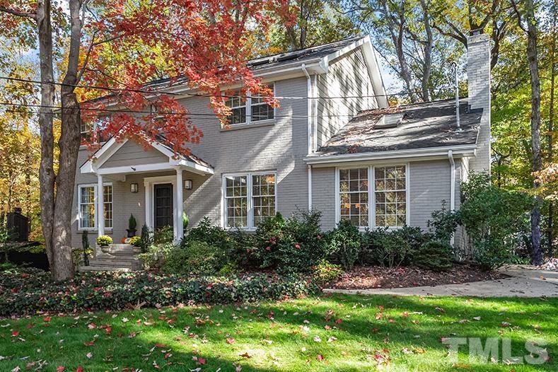 2408 Wentworth Street Raleigh, NC 27612 - Photo 2 of 33 a front view of a house with a yard