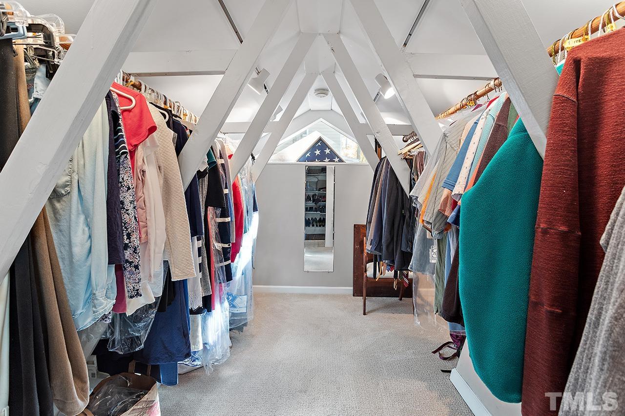 2408 Wentworth Street Raleigh, NC 27612 - Photo 23 of 33 a view of walk in closet with clothes