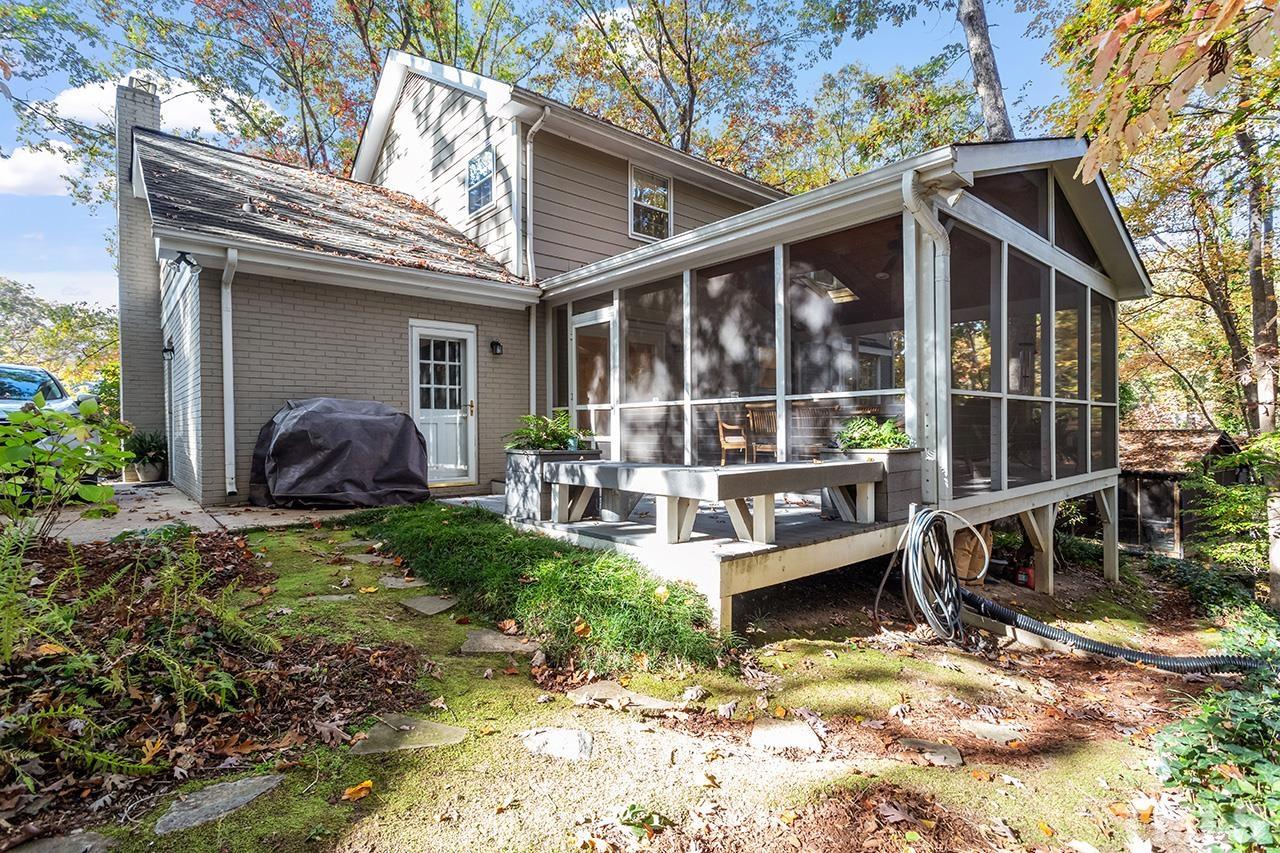 2408 Wentworth Street Raleigh, NC 27612 - Photo 31 of 33 a view of house with backyard outdoor seating and plants