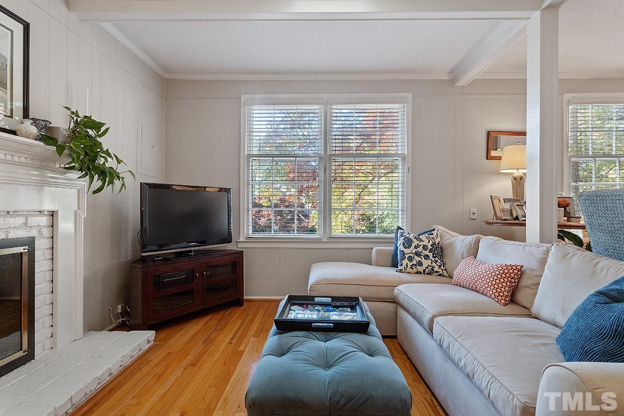 2408 Wentworth Street Raleigh, NC 27612 - Photo 4 of 33 a living room with furniture and a flat screen tv