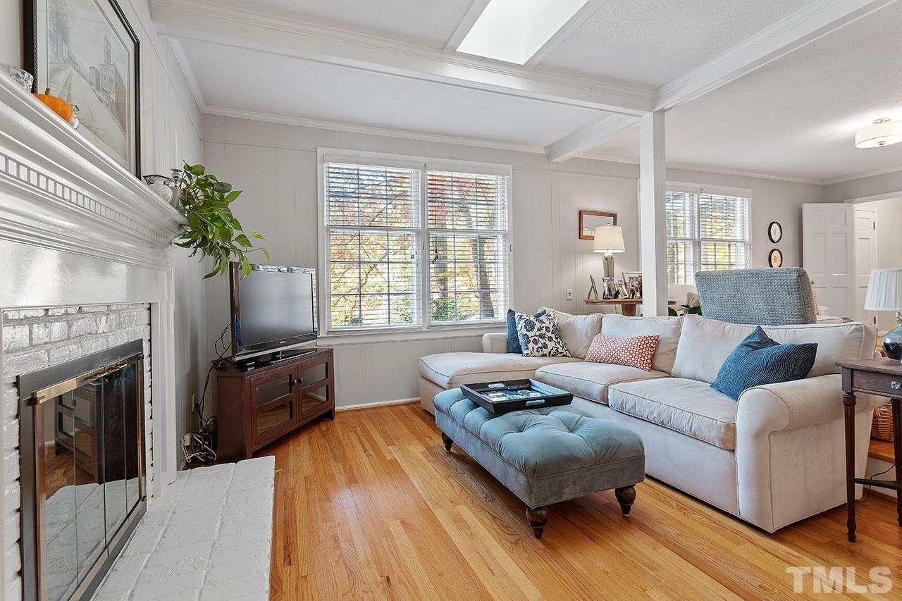 2408 Wentworth Street Raleigh, NC 27612 - Photo 6 of 33 a living room with furniture fireplace and flat screen tv