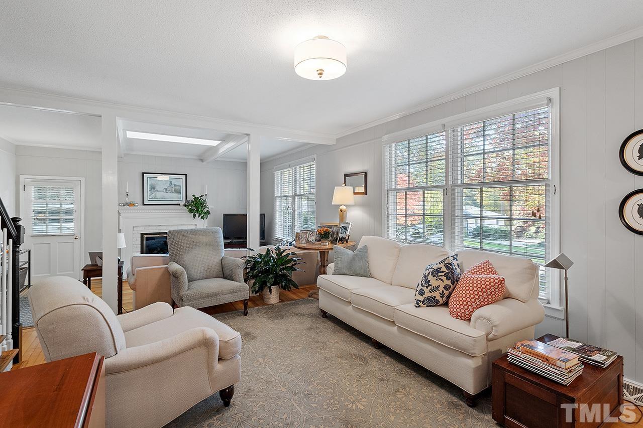 2408 Wentworth Street Raleigh, NC 27612 - Photo 8 of 33 a living room with furniture fireplace and a large window